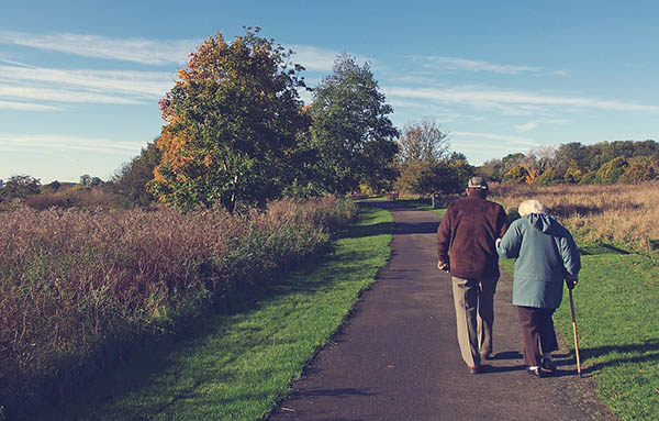 healthy senior couple walking